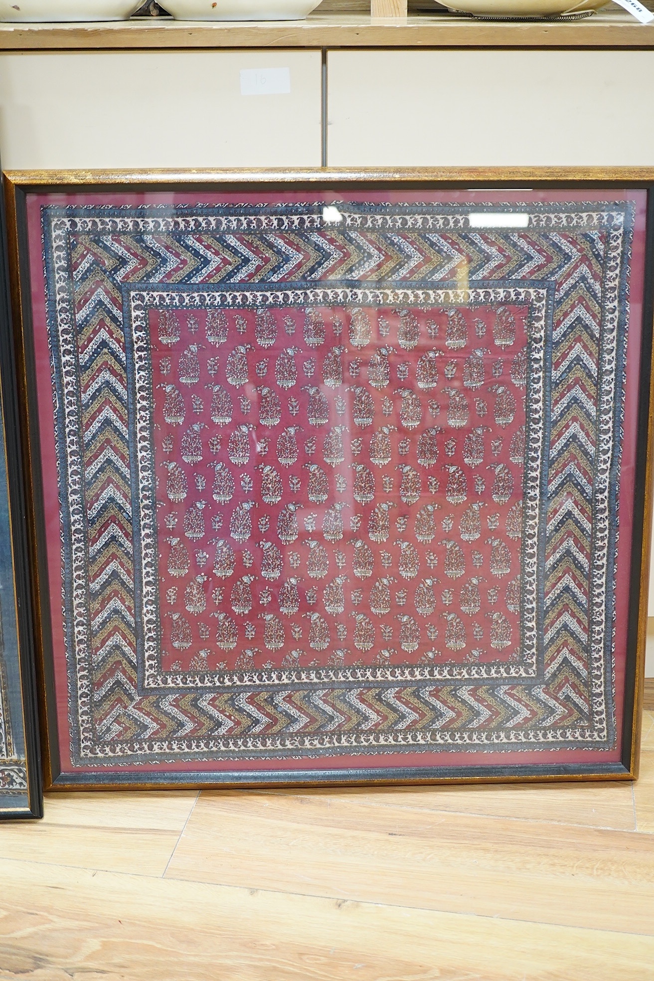 Two framed 19th century Indian Kalamkari boteh block printed prayer Niches, possibly from Machilitanam and a similar framed block printed square, possibly part of a table cover, largest 53cm wide x 67cm high (3). Conditi